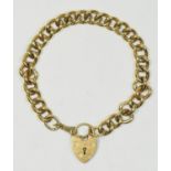 A 9ct gold hollow curb bracelet with heart padlock clasp, 9.8gm.