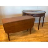 A mahogany demi lune console table, having central draw with drop brass handle, raised on square