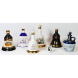 A collection of five commemorative Bells whisky decanters by Wade, comprising of - The Marriage Of