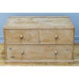 A Victorian pine chest of two short over on long drawer, bun handles, 91 x 46 x 54cm.