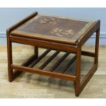 A mid-century teak and tiled top coffee table with magazine rack beneath, 56 x 50 x 44cm.