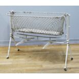 A Victorian steel adjustable child's cot, raised on four castors, 116 x 51 x 84cm extended.