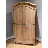 A pine double wardrobe, hinged door opens to reveal a single shelf over a single hanging rail, 103cm