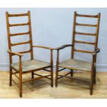 A pair of arts and crafts beech and rush seated ladder back armchairs, height 102cm.