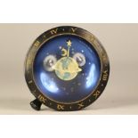 A 1936 Westclox desk paperweight clock, in a space, astrological-Zodiac planetary theme, having