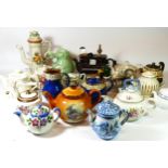 A collection of early 20th century & later ceramic teapots, together with lidded steins and