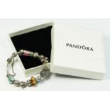 A Pandora silver and charm set bracelet, 59gm, case