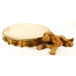 a 1960'S 'Nodding Dog' L22cm, together with a tambourine. (2).