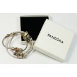 Three silver Pandora bracelets, two with charms, 68gm, box.