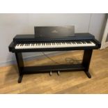 A Yamaha Clavinova CLP-350 electric piano, 141cm x 80cm x 44cm, includes manuals, songbooks,