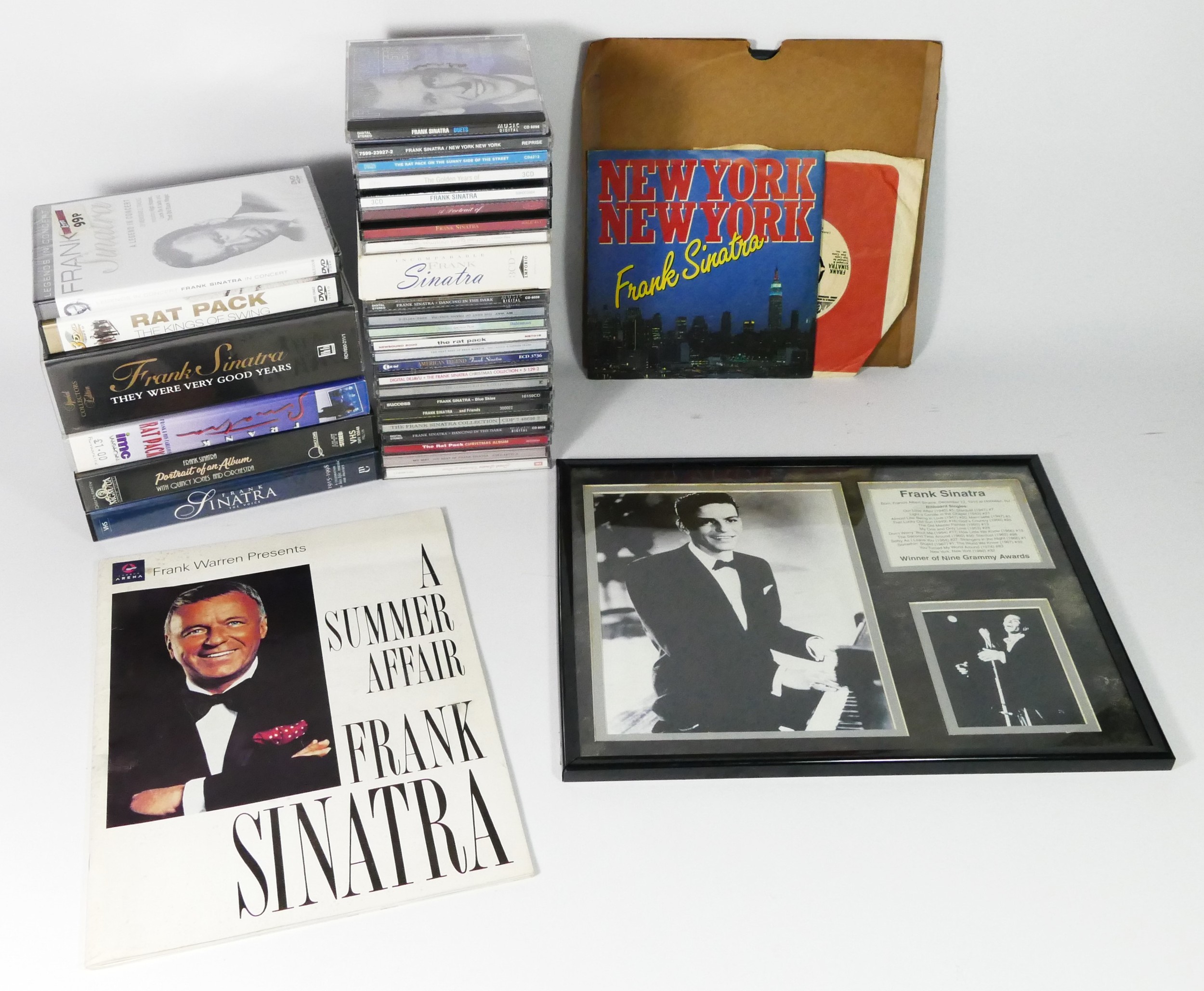 A collection of Frank Sinatra related memorabilia, to include music CD's, records, VHS tapes, a