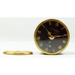 Jaeger le Coultre, a red lacquer and gold plated travel/bedside alarm clock, eight day movement,