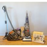 A Dyson D19 vacuum cleaner, together with a Dyson D14 upright vacuum cleaner, a Scholl massager, a