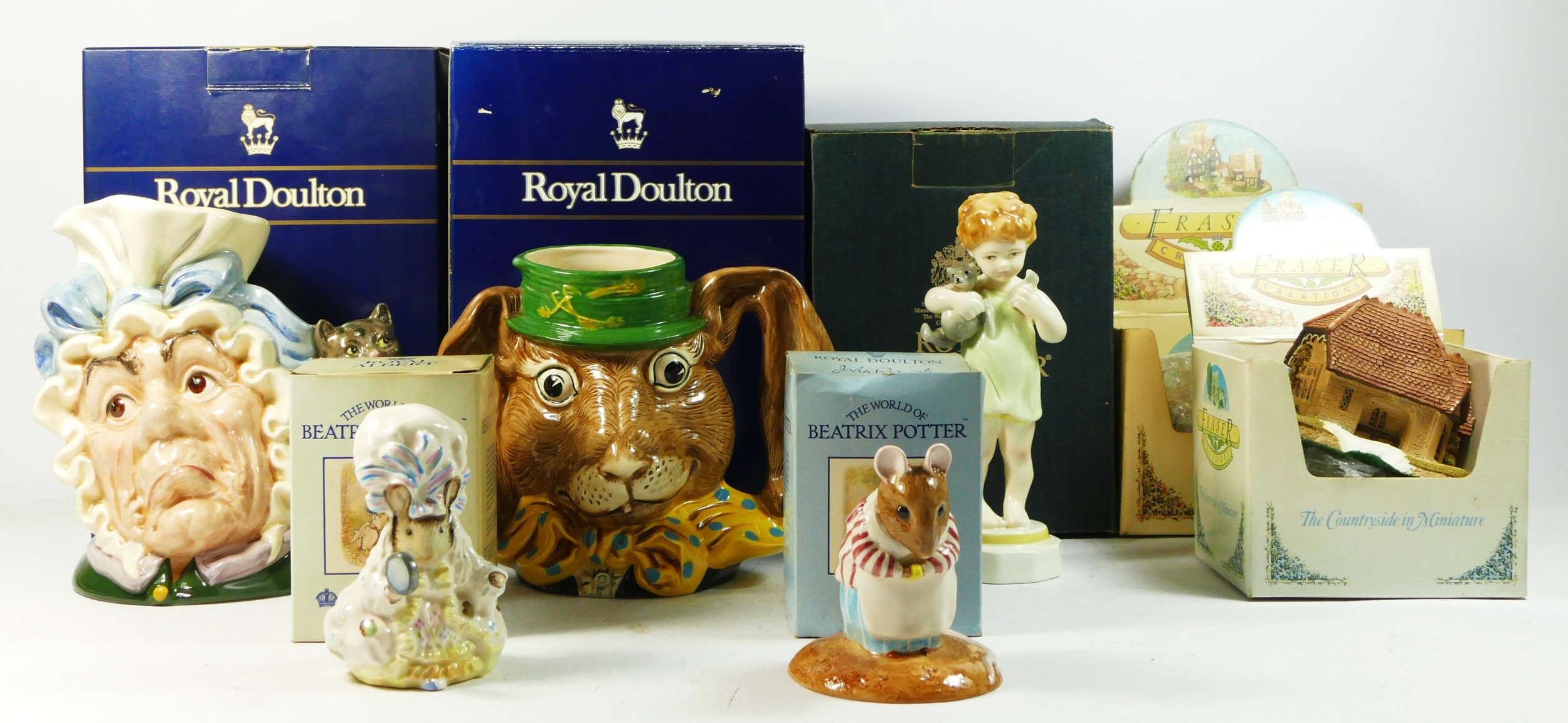 Two 1980's Doulton character jugs- 'the march hare' (D6776 boxed) 'the cook and the cheshire cat' (