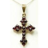 A 9ct gold and garnet set cross pendant, 30mm overall, chain, 2.3gm