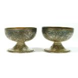 A pair of Indian Raj period silver open salts, probably Kashmir, with chased floral and scroll