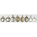 Eight various silver hinged lockets, various designs, the largest 35 x 25mm, 58gm