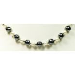 A hematite and imitation pearl bead necklace, 42cm, gold clasp
