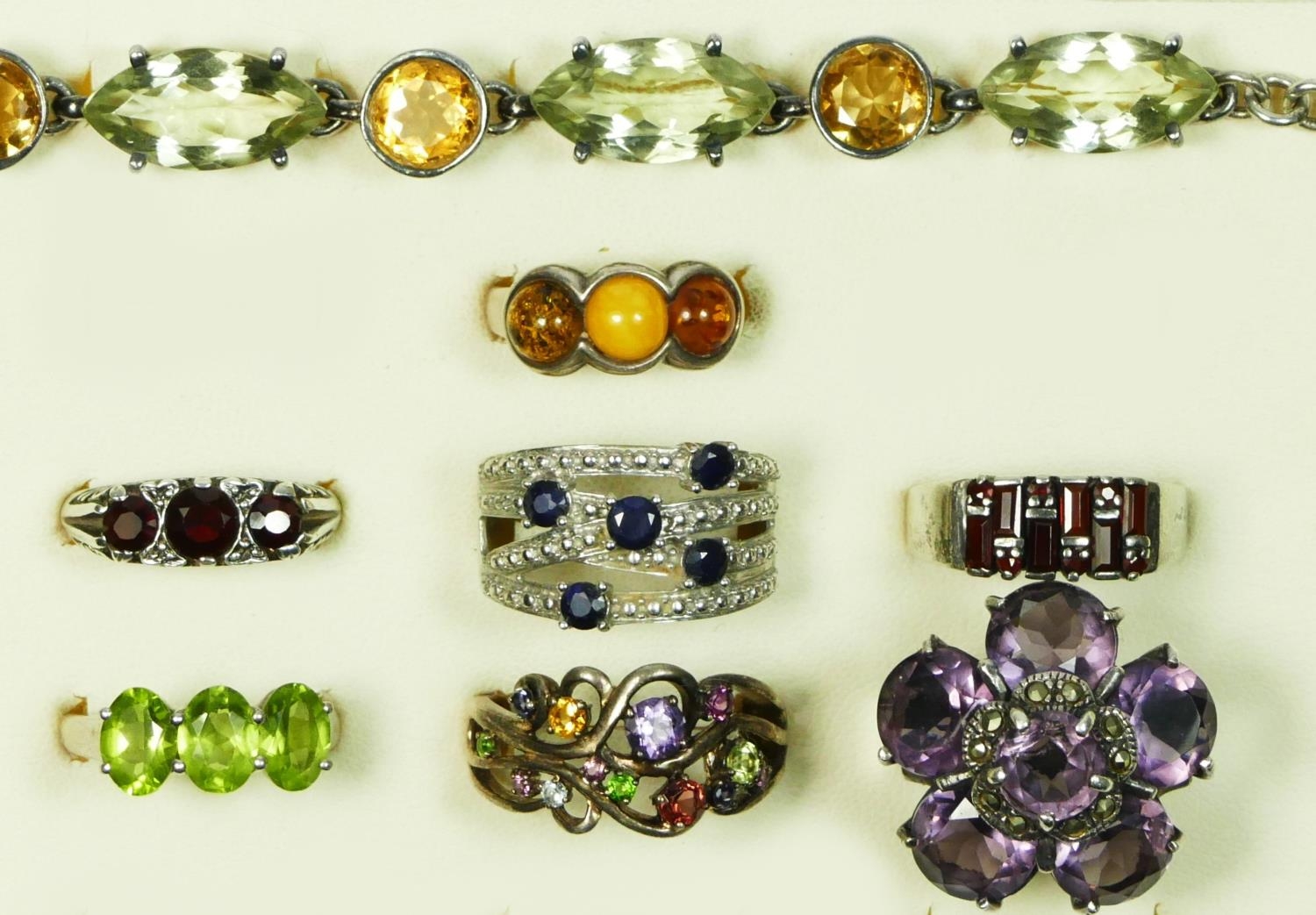 A silver mounted gemstone bracelet, 19cmand silver and gemstone set rings, 68gm