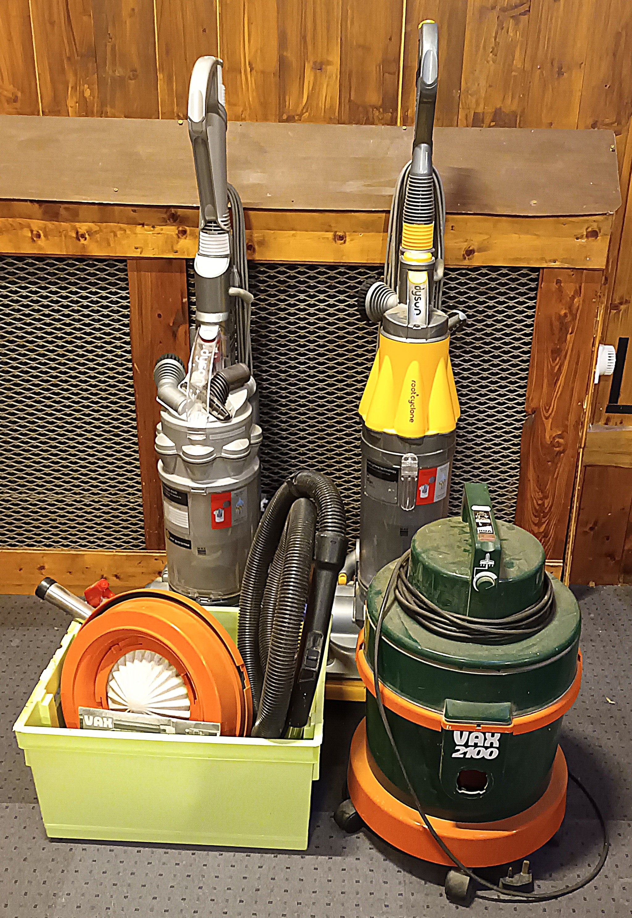 A Dyson DC14 upright vacuum cleaner, together with a Dyson DC07, and a Vax 2100 cleaner with