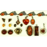 A silver and amber bracelet, two silver and amber rings, five pendants, and three pairs of ear