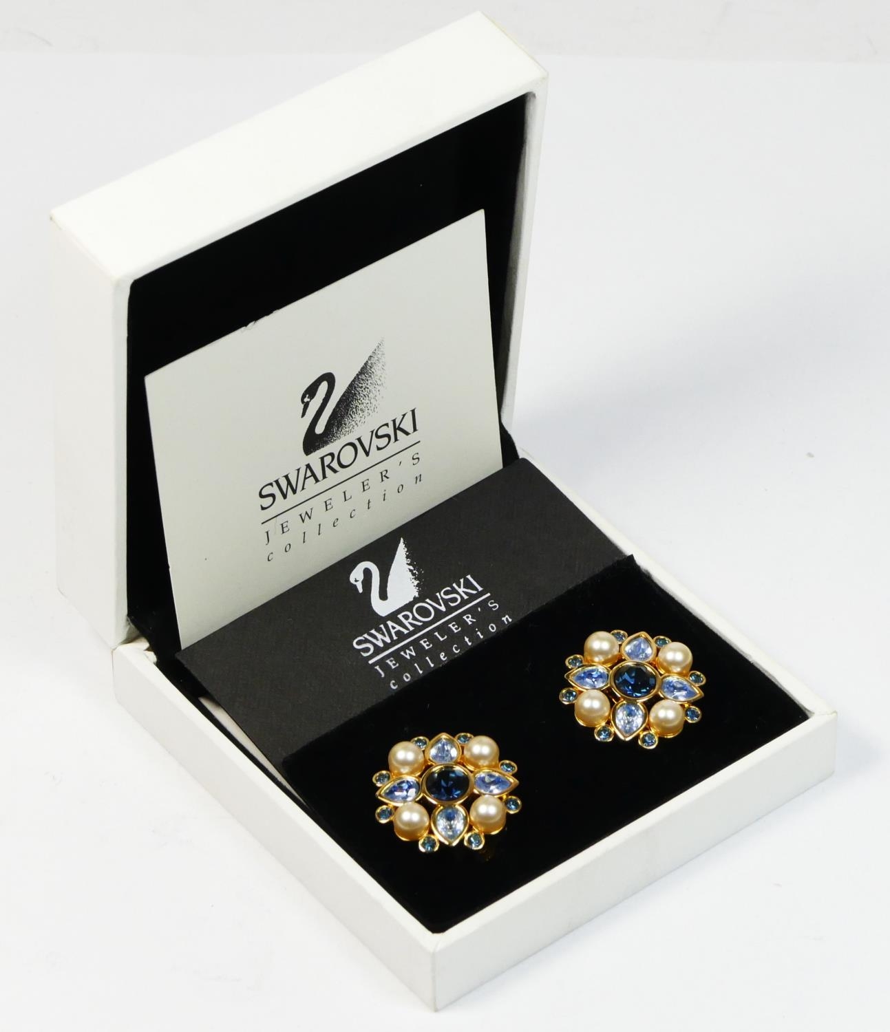 Swarovski, a pair of Jeweller's Collection blue crystal and pearl ear clips, apparently unworn,