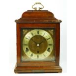 A mahogany cased bracket clock by Elliott, retailed by Arthur Saunders of London, having 8 day