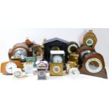 A collection of mantel clocks, having manual wind and quartz movements, to include Smiths oak