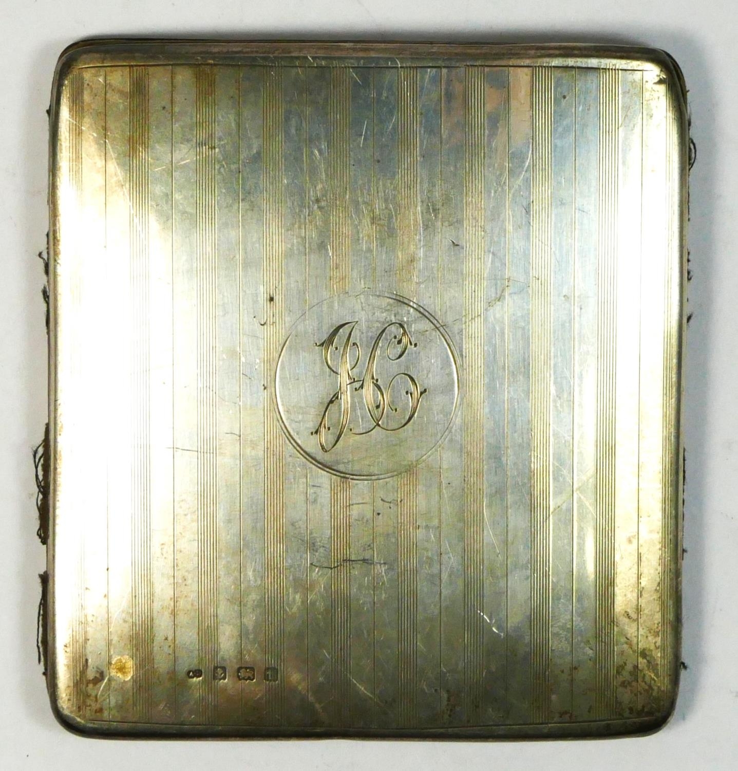An unusual silver cigarette case, Birmingham 1918, with leather interior, 9 x 8.5cm, 85gm