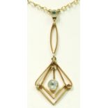 A 9ct gold Edwardian style aquamarine pendant on chain, 40cm, 2.8gm