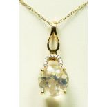 A 9ct gold colourless crystal stone pendant, diamond set surmount, 2.5gm