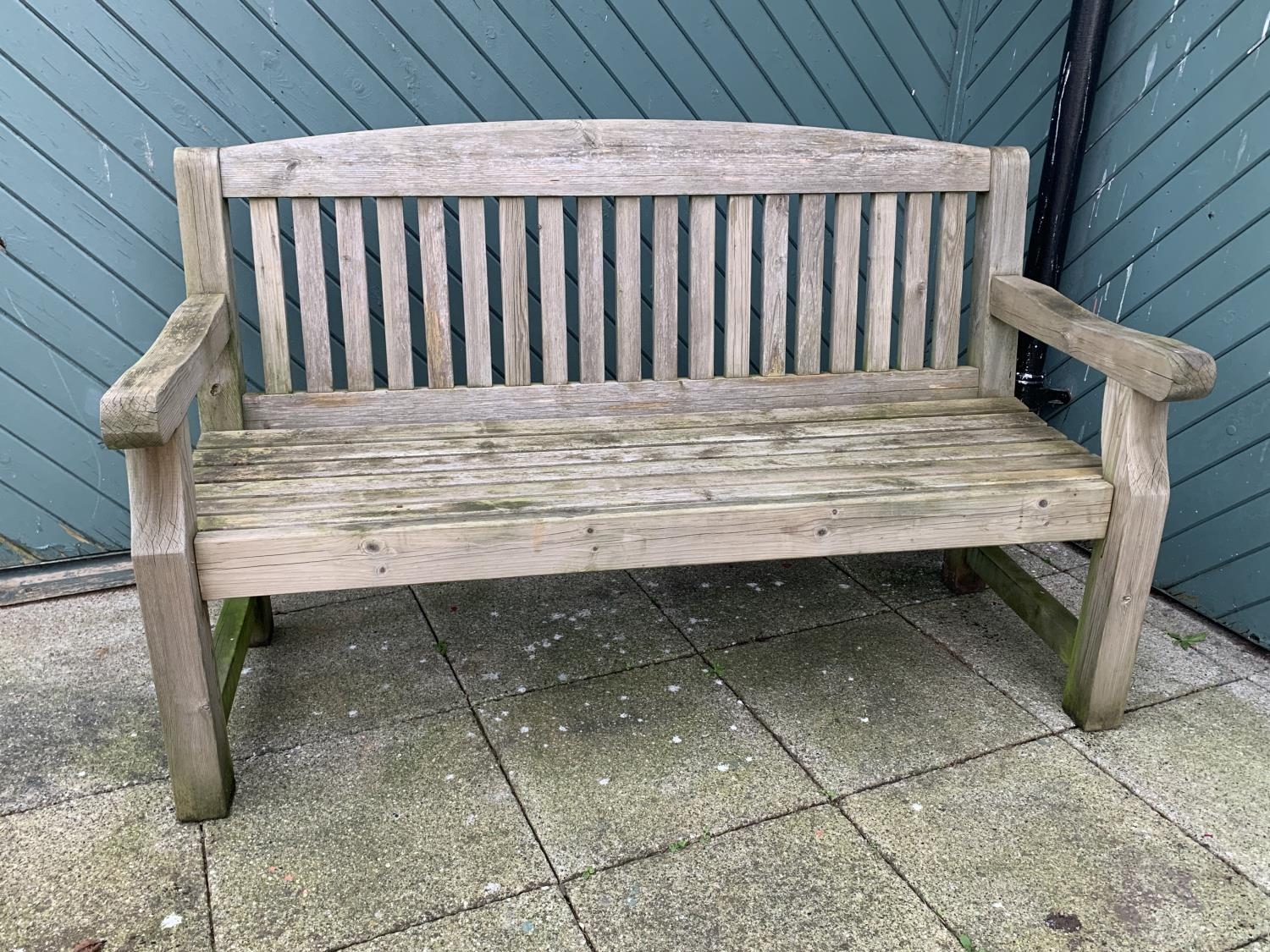 A two seat garden bench, 153cm x 94cm x 70cm