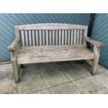 A two seat garden bench, 153cm x 94cm x 70cm