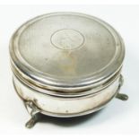 A silver trinket box, Birmingham 1911, the hinged lid with engine turned decoration, raised ob three