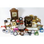 A collection of mid 20th century and later clocks, to include traveling alarm clocks, wall clocks,