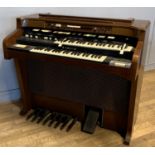 A Hammond T-524 electric organ, with built in tape deck, 111cm x 100cm x 63cm, together with a