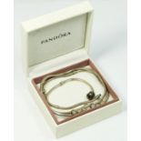 A silver Pandora necklace with charms and a silver Pandora bracelet, box, 66gm.