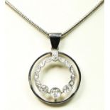 An Edwardian white metal and diamond openwork pendant, milligrain collet set with old cut