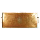 An Arts & Crafts copper two handled tray, embossed B bordered by chased honesty leaves, 60 x 24cm