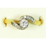 An 18ct gold and brilliant cut diamond ring, diamond set shoulders, stated weight 0.30cts, colour