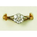 An Edwardian 18ct gold and old cut brilliant diamond cluster ring, unmarked, approximately 0.