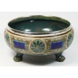 Doulton Lambeth, a Victorian stoneware bowl, by Ellen Rambold, with geometric designs, raised on