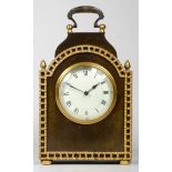 An early 20th century French mantel clock, having arched top with burnished brass case and