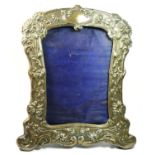 An Edwardian silver photograph frame, by Walker & Hall, Chester 1904, design number 430261, with