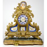 A Louis XVI style gilt metal and sevres porcelain inset mantel clock, late 19th early 20th