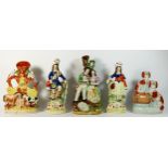 Five Staffordshire pottery flat back figures, to include a spill vase with a cow and horse, 27cm,