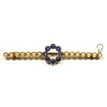An Edwardian 15ct gold, sapphire (probably Montana) and pearl bar brooch, 15 tab, milligrain