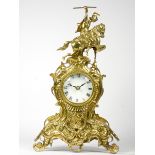 An early 20th century Ormolu style mantel clock, scroll and floral decorated gilt metal case,