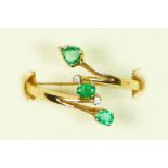 A gold, emerald and brilliant cut diamond set dress ring, probably 18ct, N, 2.4gm