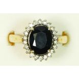 A 9ct gold sapphire, 10 x 8mm, and diamond cluster ring, O, 4.7gm